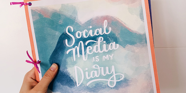 aerial view of handmade book titled 'social media is my diary'